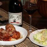 Pasta dinner. Spaghetti and meatballs with wine and caesar salad.